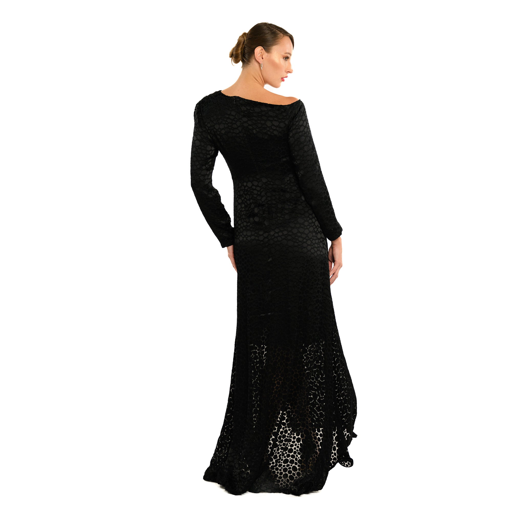 Woman wearing a black long-sleeve evening gown on a white background