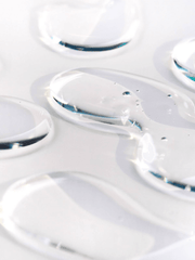 Close-up of clear gel-like substance on a white background