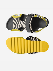 Black sandals with zebra pattern straps and yellow soles on a white background