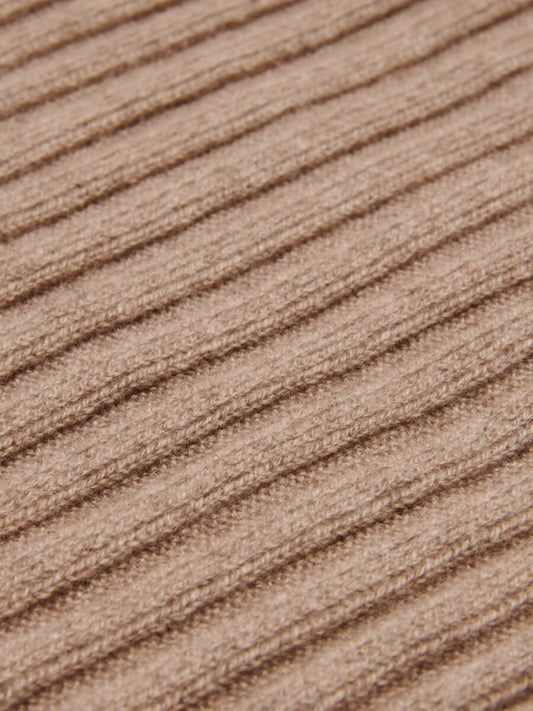Close-up of a textured brown fabric surface