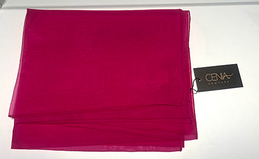 Folded pink fabric with a CENA New York tag on a white background