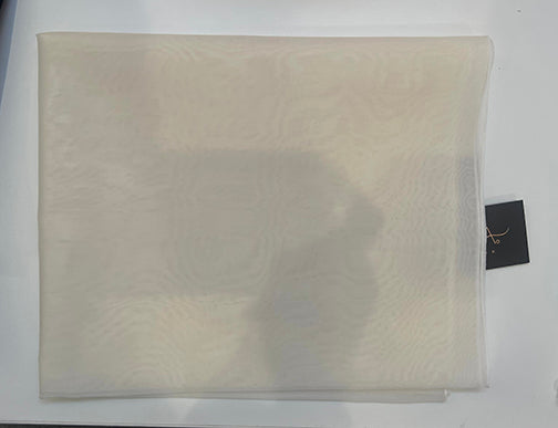 Beige fabric with a tag on a white background