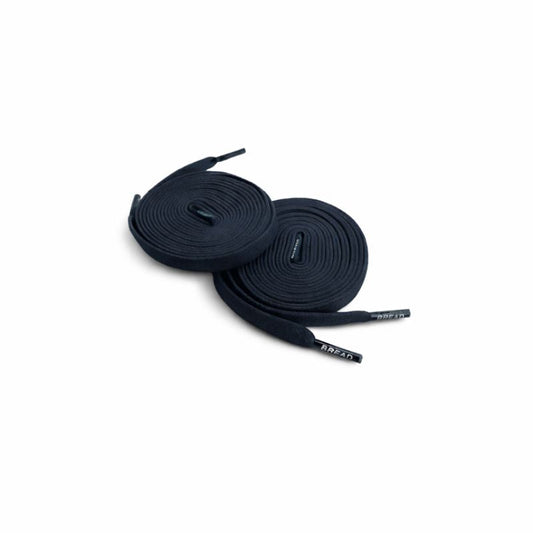 Pair of black shoelaces on a white background