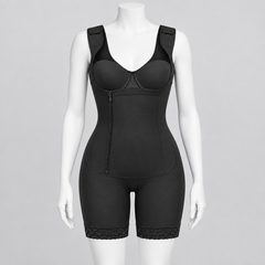 Black shapewear bodysuit with built-in bra cups, front zipper, and lace-trimmed shorts on a white mannequin against a light gray background.