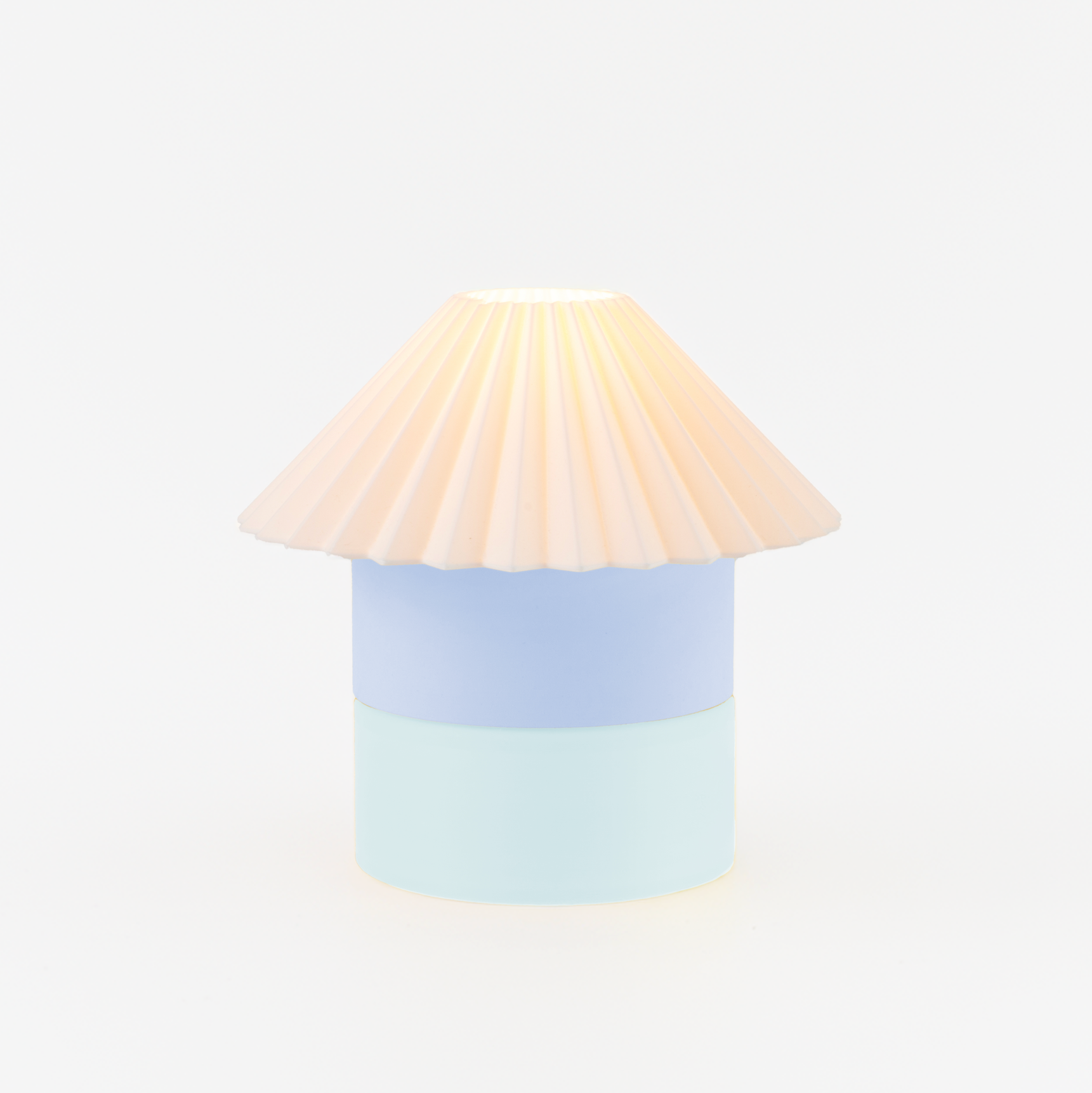 Lamp with a beige shade and light blue base on a white background