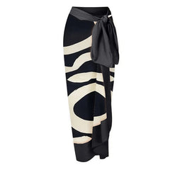 Black and white striped skirt with a tie on a white background