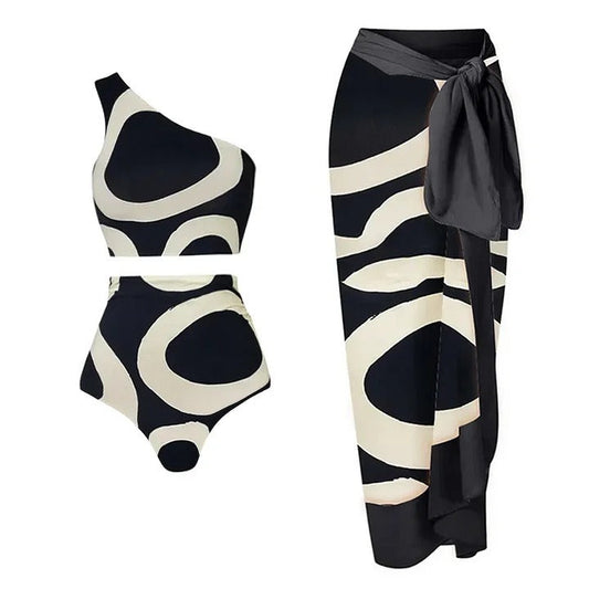 Black and white patterned swimsuit with matching sarong on a white background