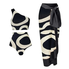 Black and white patterned swimsuit with matching sarong on a white background
