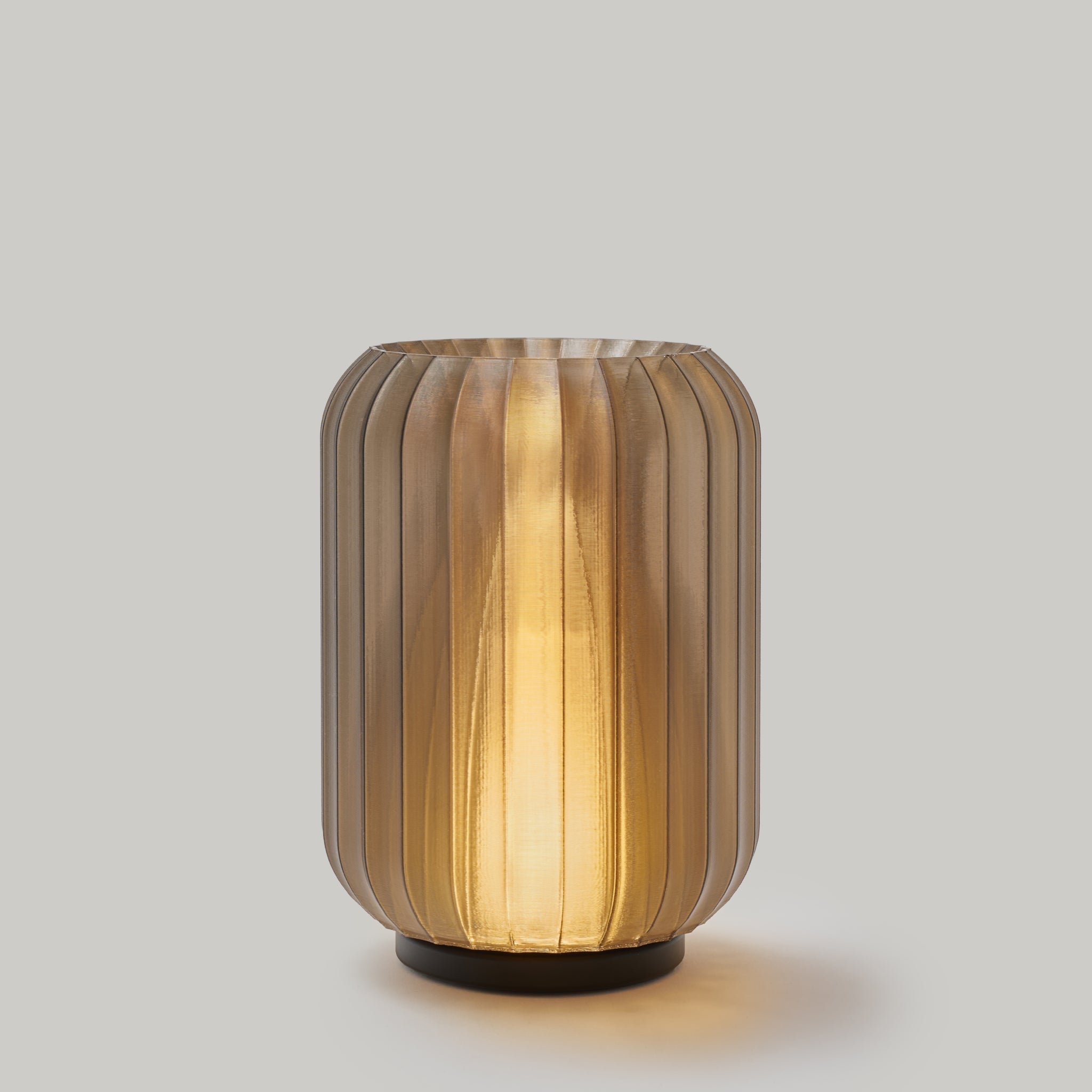Decorative lamp with ribbed design on a plain background