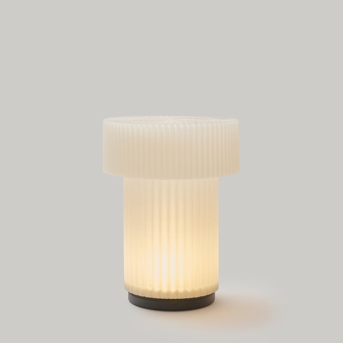 White textured table lamp on a gray background