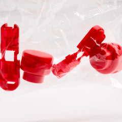 Red plastic components on a white background