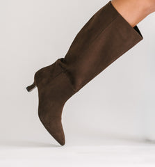 Brown knee-high boot on a white background