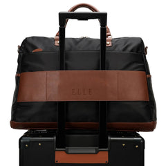 Black and brown travel bag with 'ELLE' branding on a white background
