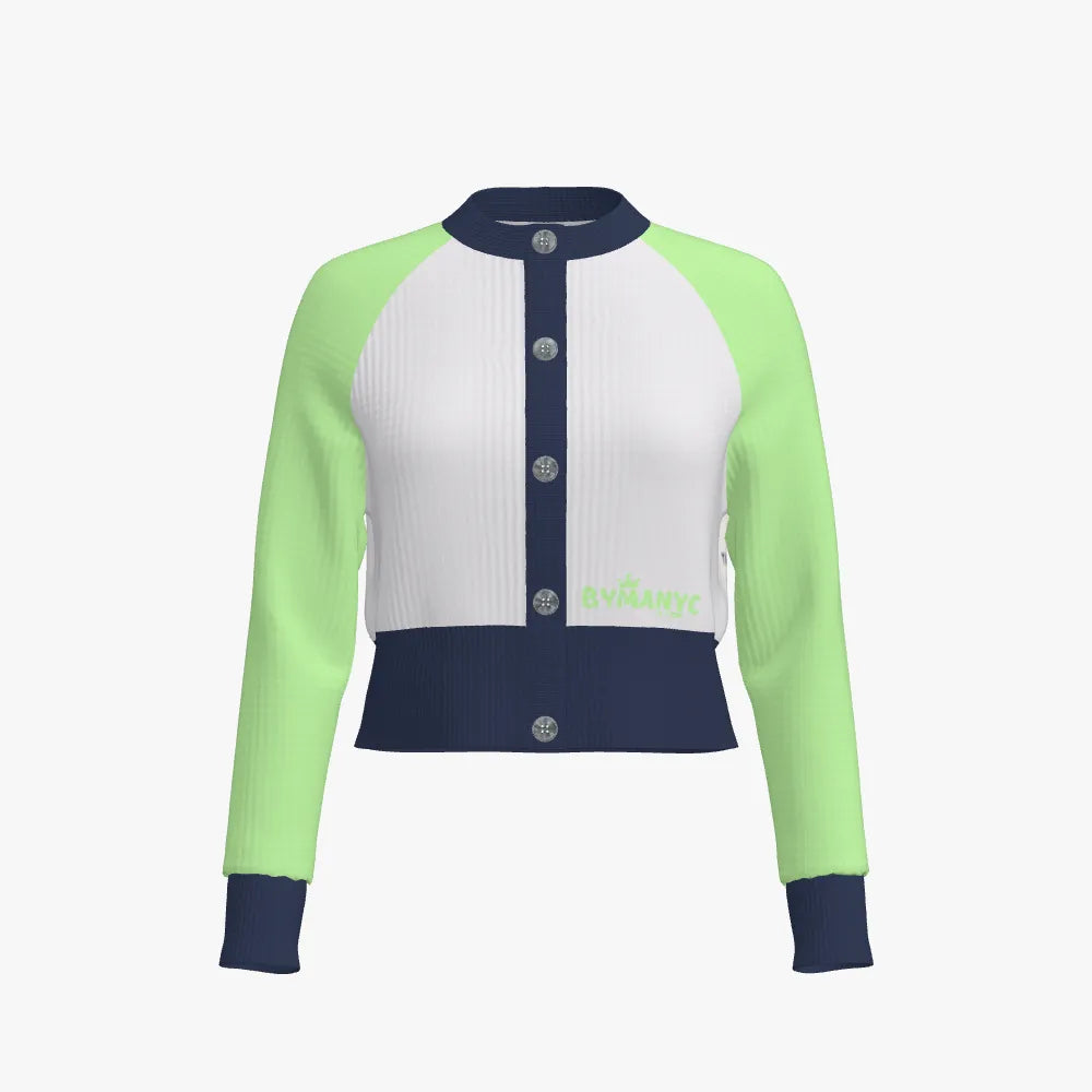 Color-blocked cardigan with green sleeves, white body, and navy accents on a white background