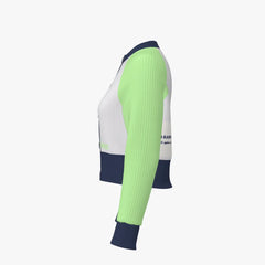 Long-sleeve athletic shirt with green sleeves and white body on a light gray background