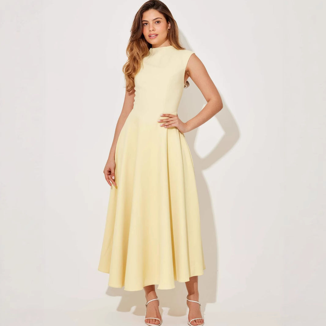 Woman wearing a light yellow dress on a white background