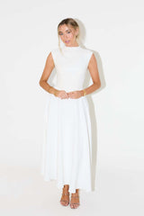 Woman wearing a white sleeveless dress on a white background