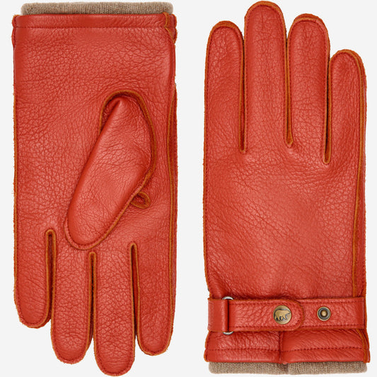 Pair of red leather gloves with a button closure on a white background