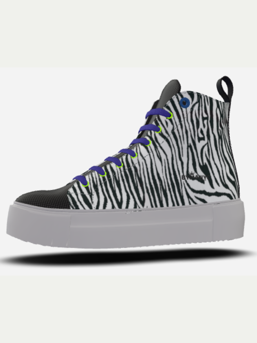 Zebra-patterned sneaker with black, white, and gray design on a white background