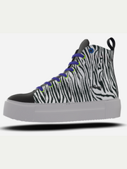 Zebra-patterned sneaker with black, white, and gray design on a white background