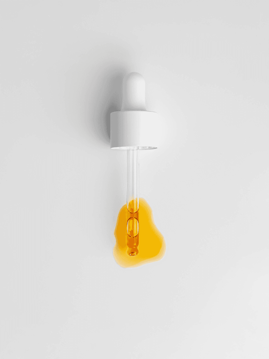 Light bulb with a white base and amber glass on a light gray background