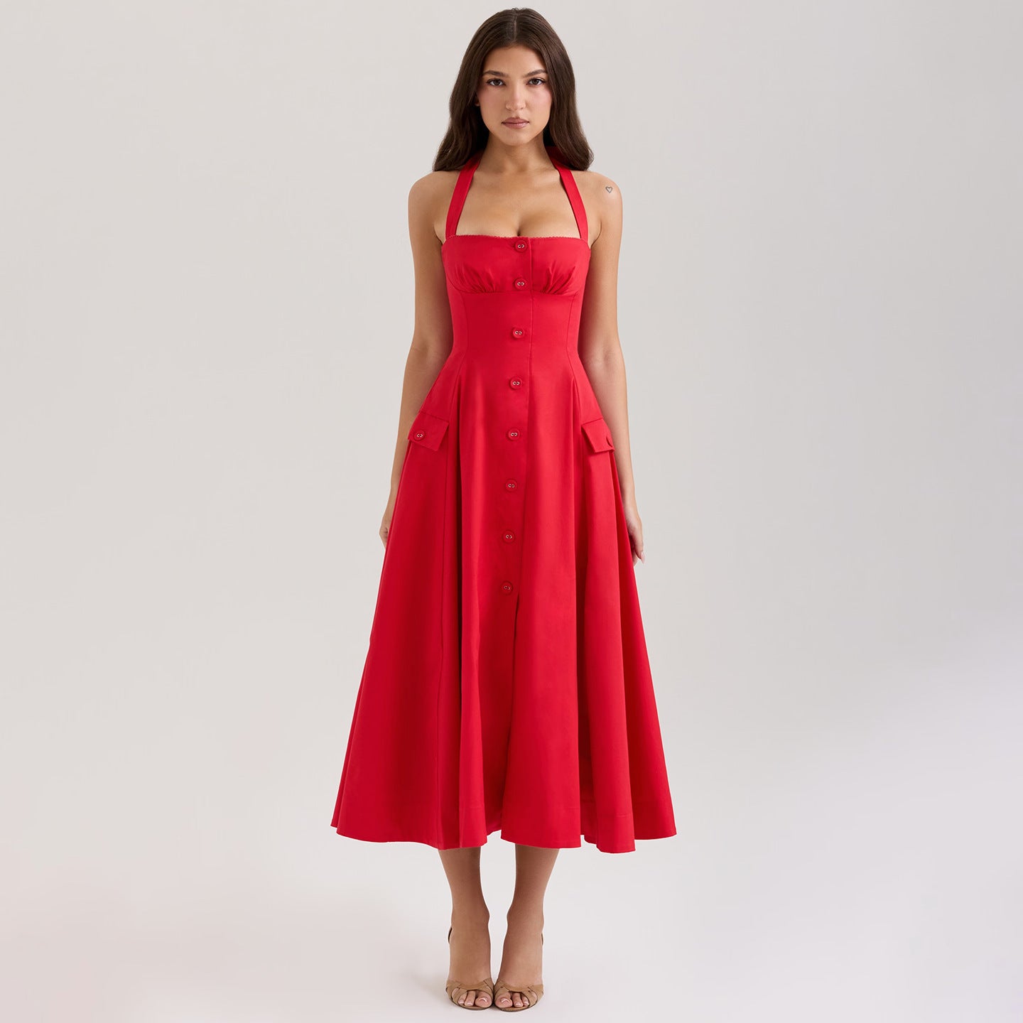 Red dress worn by a model on a light gray background