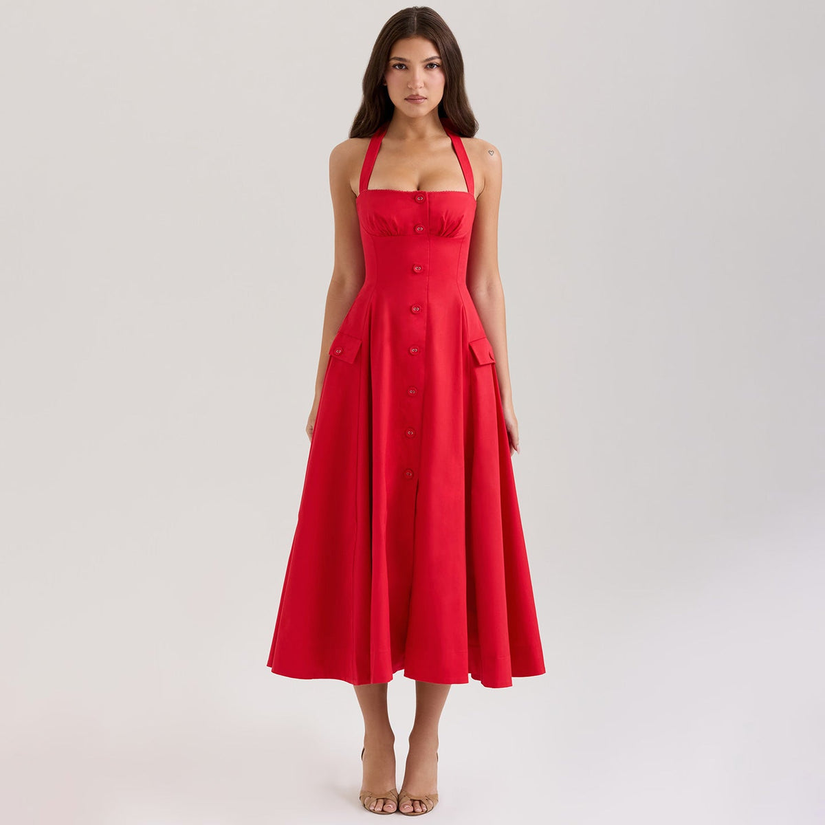 Red dress worn by a model on a light gray background