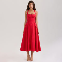 Red dress worn by a model on a light gray background