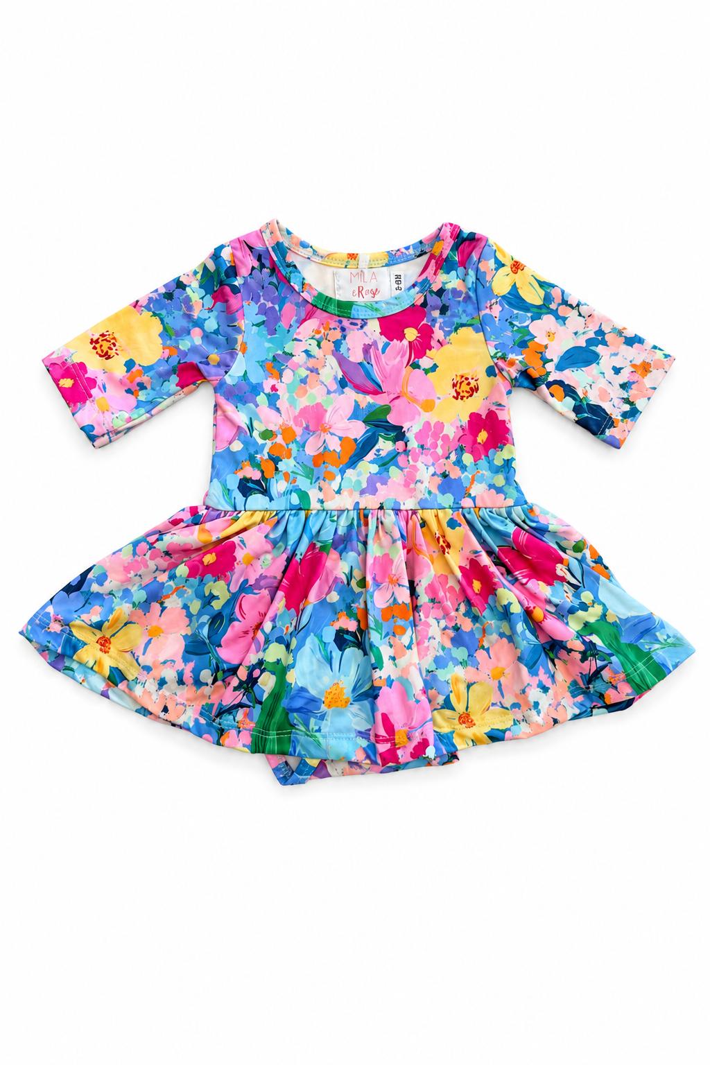 A toddler's long-sleeve dress with a vibrant, multicolor floral and bird print, laid flat on a white background.