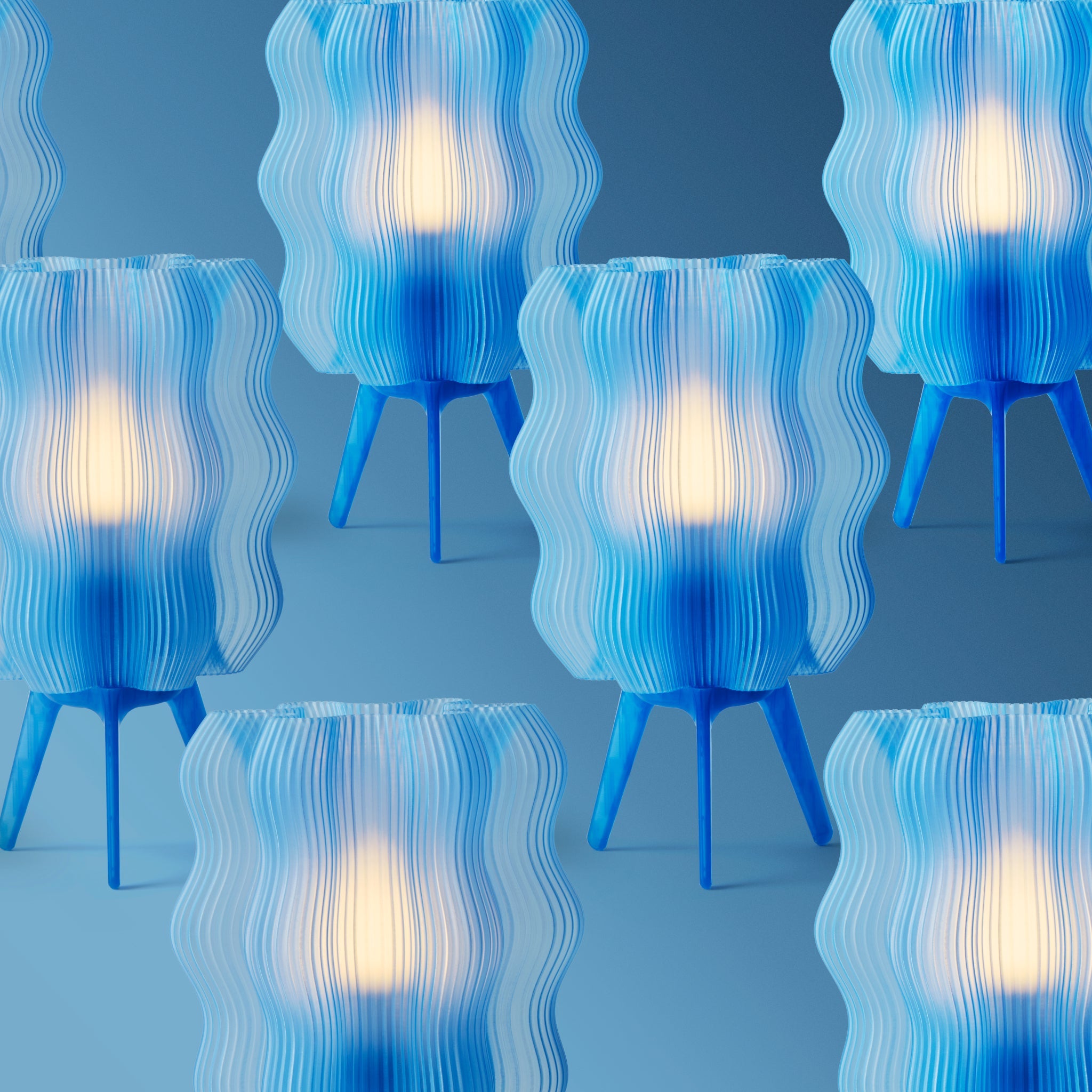 Blue and white wavy table lamps on a blue background