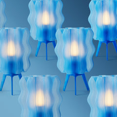 Blue and white wavy table lamps on a blue background