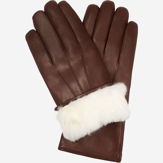 Black leather gloves with white fur cuffs on a white background