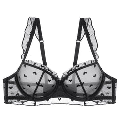 Black and white bra with heart patterns on a white background