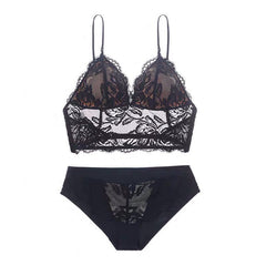 Black lace bra and panties set on a white background