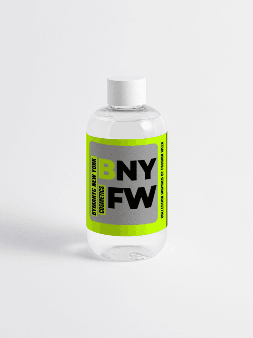 Clear bottle with a green and black label on a white background