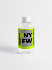 Clear bottle with a green and black label on a white background