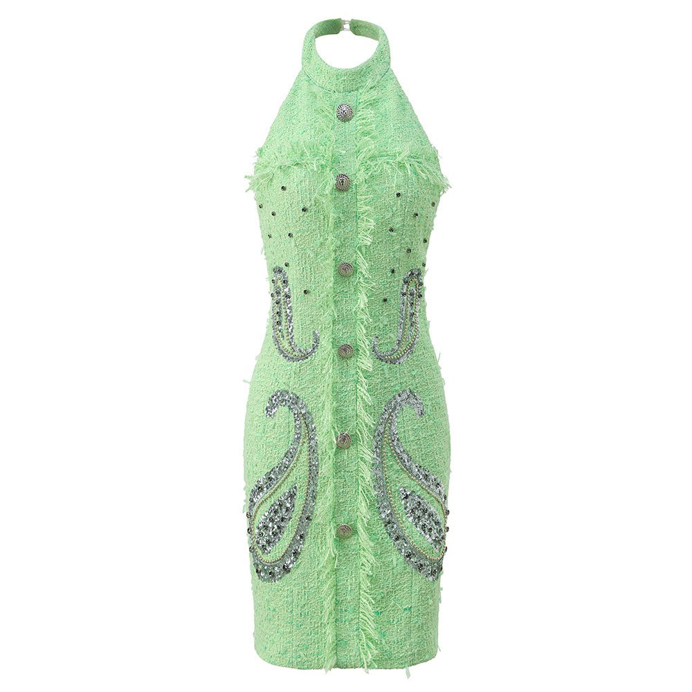 Green dress with paisley patterns and buttons on a white background
