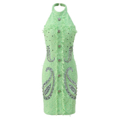 Green dress with paisley patterns and buttons on a white background