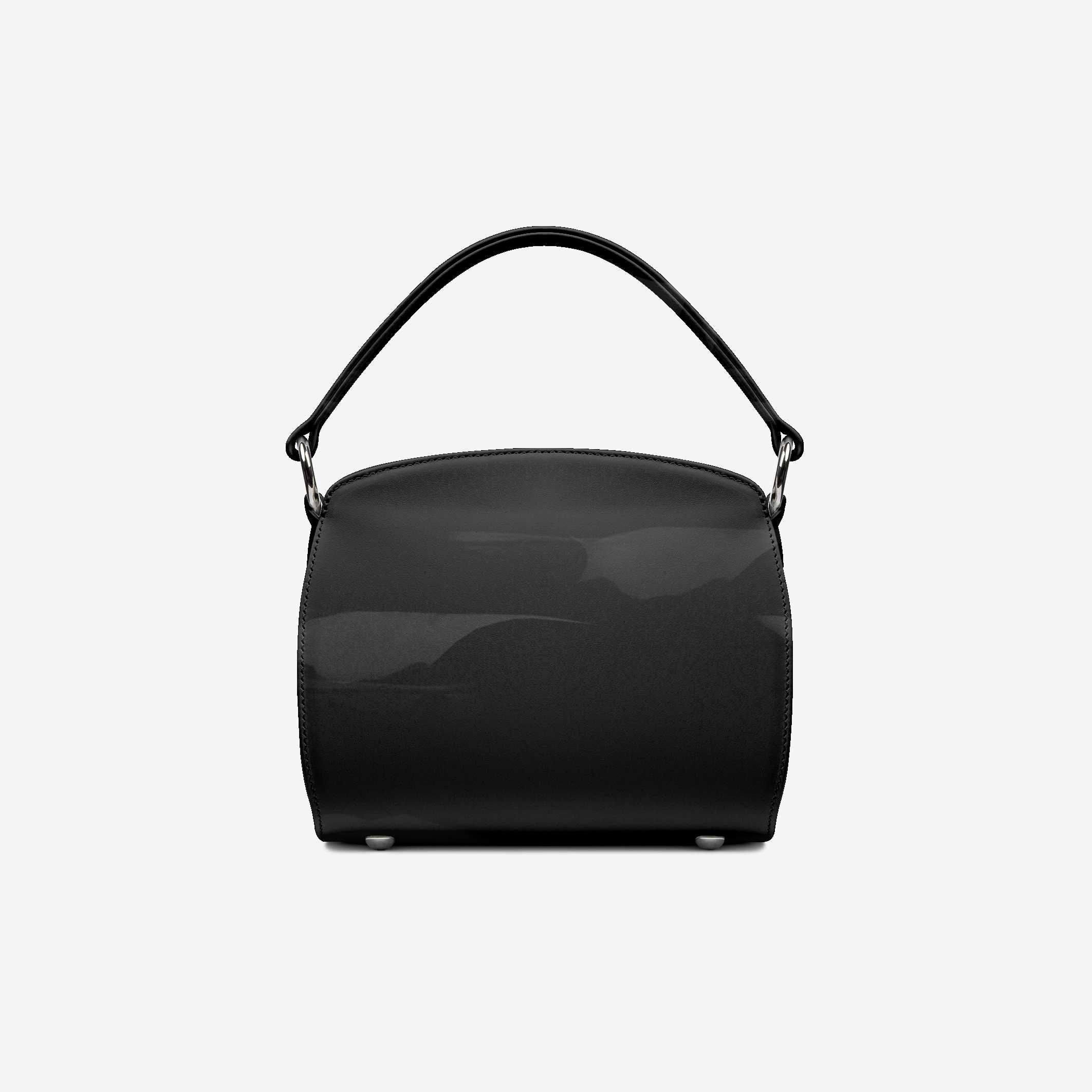 Black handbag on a light gray background