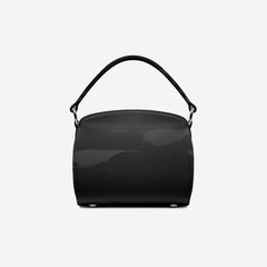 Black handbag on a light gray background