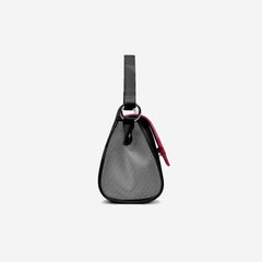 Small black bag with a strap on a light gray background