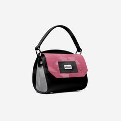 Black and pink handbag with a visible brand logo on a light gray background