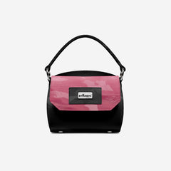 Black and pink handbag with 'BYSMNYC' logo on a light gray background