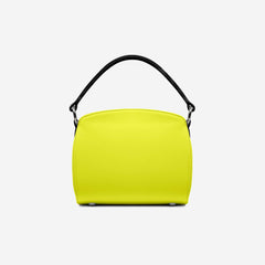Yellow handbag with a black handle on a light gray background