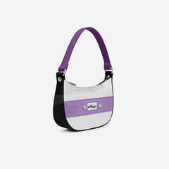Handbag with purple strap and accents on a white background