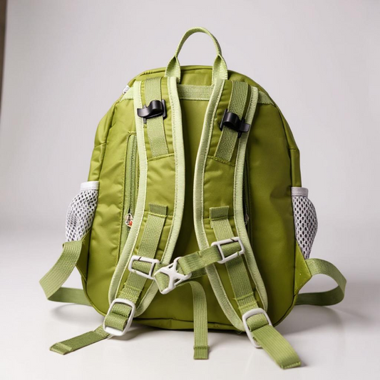 Green backpack with multiple straps on a light gray background