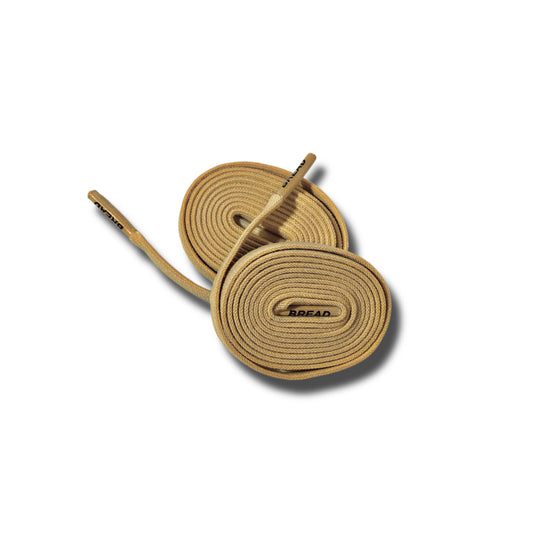 Pair of tan shoelaces with a brand logo on a white background