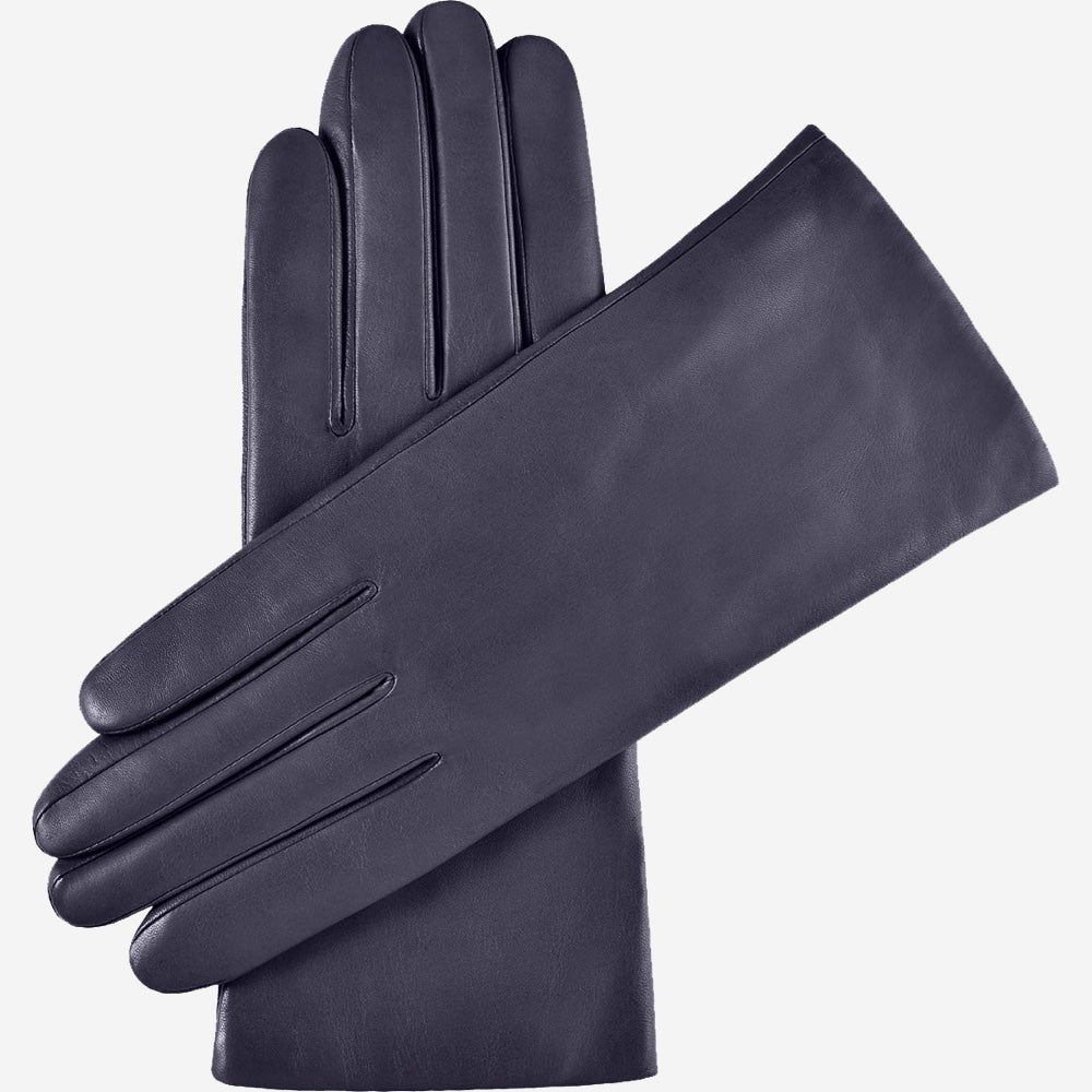 Pair of dark blue leather gloves on a white background