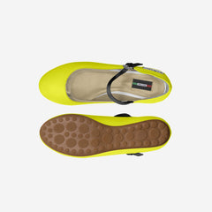 Flip-flop sandal with yellow sole and brown bottom on a white background