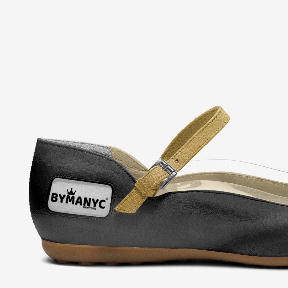 Black shoe with a tan strap and ByManyc logo on a white background